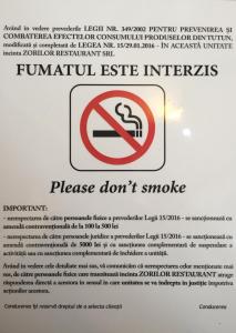 a sign that says please dont smoke at ApartHotel Zorilor in Cluj-Napoca