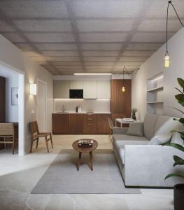 a living room with a couch and a table at Apartamentos Turísticos A Mariña Do Carril in Vilagarcia de Arousa