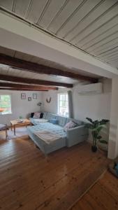 a large living room with a large bed and a couch at Typisches Schwedisches Haus in Eriksmåla