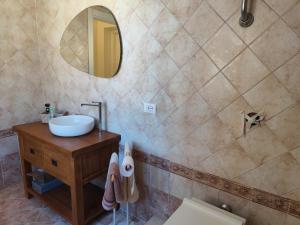 a bathroom with a sink and a mirror at Reale Home in Casa Tonietti +53 photos