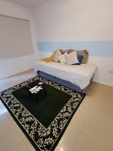 a bed with a table in a room at SAN jose in Federación