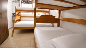 a room with two bunk beds and a room with at La Gran Casa in San Andrés