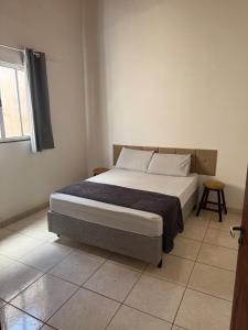 a bedroom with a bed in a room at Palmeira House in Formosa