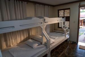 a group of bunk beds in a room at La Casa Josefina in Aga