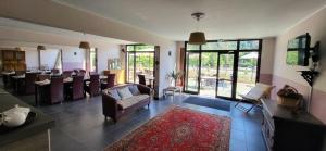 a living room with a couch and a table at Le Marina in Porto Ota