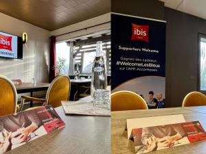 a dining room with a table and a sign at ibis Aurillac in Aurillac