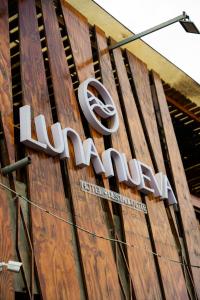 a sign on the side of a building at Hotel Luna Nueva in Colán +3 photos