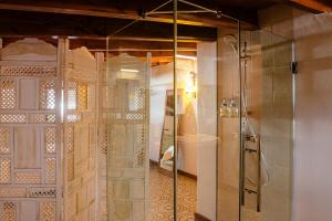 a bathroom with a shower with a glass door at Finca Vilaflor in Vilaflor