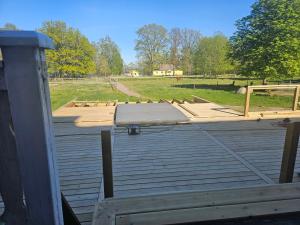 a ramp on top of a deck with a field at Spa For Hjo in Hjo
