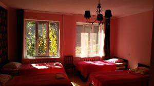 Postel nebo postele na pokoji v ubytování Red Stone Guest House