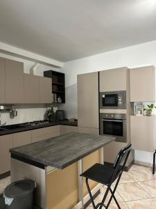 a kitchen with a granite counter top in a room at La Casa di Aira in Martina Franca