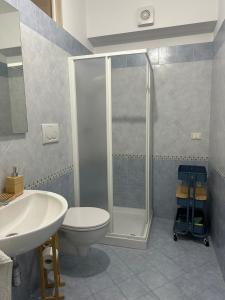 a bathroom with a shower and a toilet and a sink at La Casa di Aira in Martina Franca +10 photos
