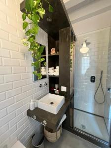 a bathroom with a sink and a shower at La Casa di Mariano in Terrasini +41 photos