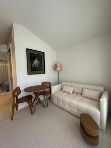 a living room with a couch and a table at Dovecote Houses in Viana do Castelo