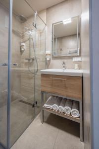 a bathroom with a sink and a shower at Casa Plus in Villach +125 photos