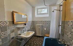 a bathroom with a sink and a mirror at Helle Ferienwohnung - Südeifel bei Neuerburg in Ammeldingen +62 photos