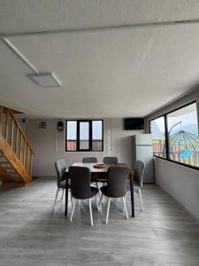 a dining room with a table and chairs at Racha Hills in Ambrolauri