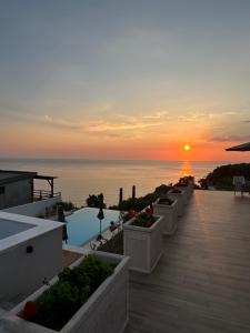 a view of a sunset from a resort with a pool at Apartments Blue Heaven in Ulcinj