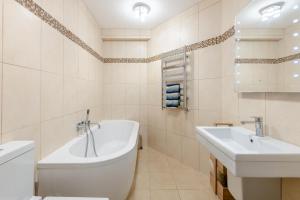 a white bathroom with a tub and a sink at 2 Bed in Torcross oc-bcatbe in Torcross +27 photos