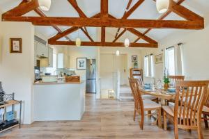 a kitchen and dining room with a table and chairs at 3 Bed in Bishop Auckland oc-36671 in Wolsingham