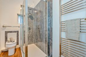 a bathroom with a shower and a toilet at 3 Bed in Bishop Auckland oc-36671 in Wolsingham +43 photos