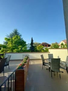 a patio with chairs and a table on a balcony at Pension Kiwi in Mikulov