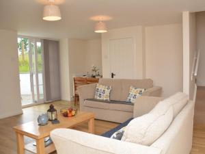 a living room with a couch and a table at 1 Bed in Kelso oc-52538 in Morebattle
