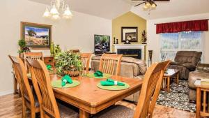 a living room with a wooden table and chairs at WP651 Smokin' Views Penthouse in Pigeon Forge