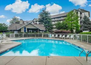 a large swimming pool in front of a house at WP651 Smokin' Views Penthouse in Pigeon Forge