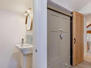 a bathroom with a white door and a sink at 2 Bed in Settle oc-g0051 in Settle +14 photos