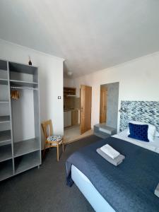 a bedroom with a bed and a room with water at Pension Kiwi in Mikulov