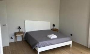 a bedroom with a bed in a white room at Suite del Colonnello B&b in Rionero in Vulture
