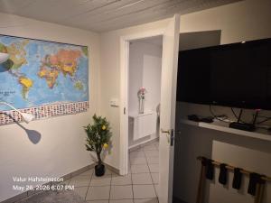 a room with a map of the world on the wall at Basement hideaway in Akureyri