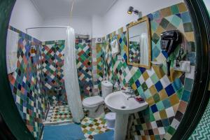a bathroom with a sink and a toilet and a shower at Riad YAMNA - Quiet Desire in Fez +101 photos