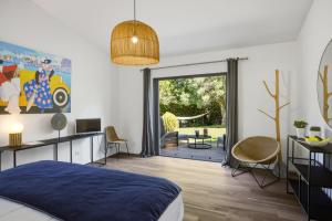 a bedroom with a bed and a sliding glass door at A Casa Bianca in Saint Paul de Vence +50 photos