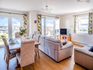 a living room with a couch and a table at 3 Bed in Shanklin oc-ic180 in Shanklin