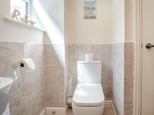 a bathroom with a toilet and a sink at 3 Bed in Shanklin oc-ic180 in Shanklin +14 photos