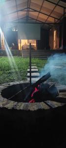 a fire hydrant with smoke coming out of it at Cabaña el Pilar in Fusagasuga
