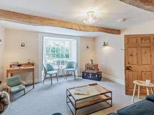 a living room with a table and chairs at 3 Bed in Settle oc-92466 in Settle