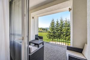 a room with a balcony with a view at Apartmán Zara in Telgárt