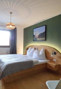 a hotel room with a bed with white pillows at Ferienhaus Ströbl in Liesing