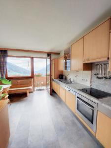 a kitchen with a large window with a view at Ferienhaus Ströbl in Liesing