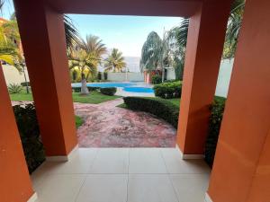 a view from a hallway of a house with a pool at Gladi Hidalgo in San Francisco de Macorís