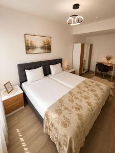 a bedroom with a large bed in a room at Airport Suite Trabzon in Trabzon
