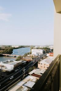 a view of a city with a river and buildings at Riverview Loft in Iloilo City