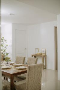 a dining room with a table and chairs at Riverview Loft in Iloilo City