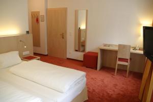 Postel nebo postele na pokoji v ubytování Austria Classic Hotel Heiligkreuz