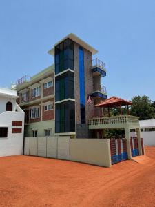 a building with a gazebo in front of it at The Luxora Villa in Kuilapayam
