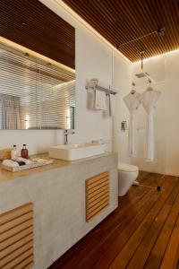 a bathroom with a sink and a toilet at Casa Carmen Xólotl in Oaxaca City +115 photos