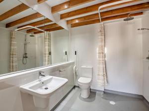 a white bathroom with a sink and a toilet at 2 Bed in Conwy oc-95905 in Conwy +20 photos